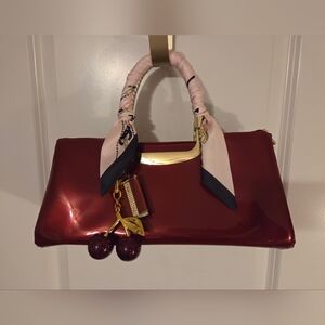 Elegant Red Handbag with Scarf Detail